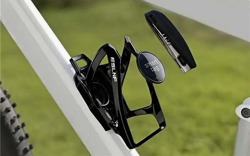 iFindX smart tag anti-theft solution disguised within a black bicycle bottle cage mount